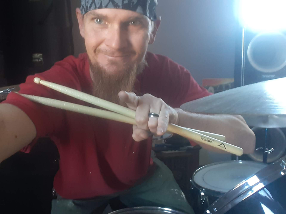 Kevin takes a selfie at his drum kit